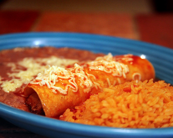 Enchilada, rice and beans